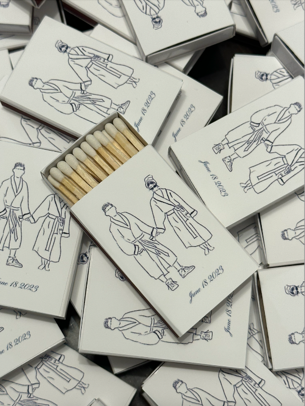 Hand drawn illustration of couple for their wedding party favors. Black and white custom personalized matchboxes.