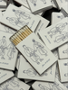 Hand drawn illustration of couple for their wedding party favors. Black and white custom personalized matchboxes.