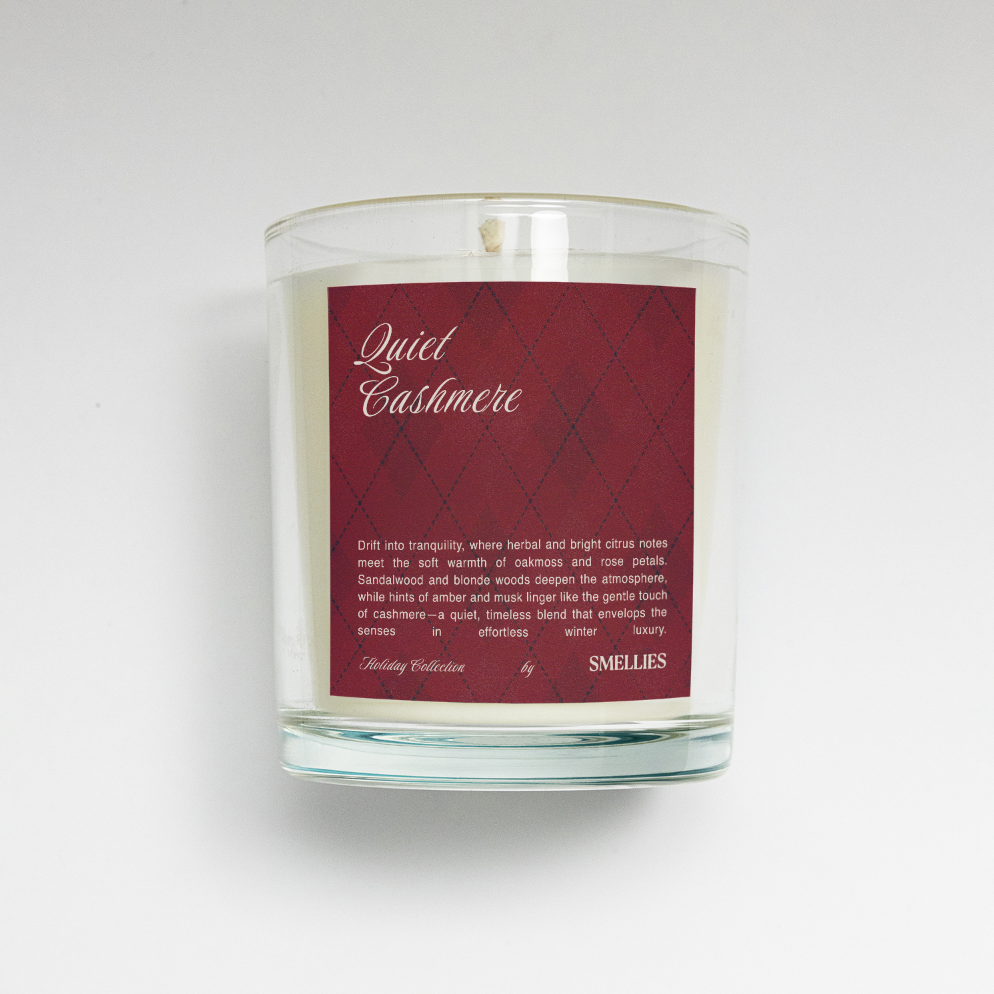 Quiet Cashmere Candle, glass jar styled on a holiday mantle with warm light